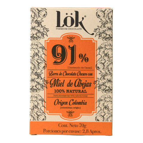 Chocolate bar packaging with 'Lök' branding and floral designs on a beige background