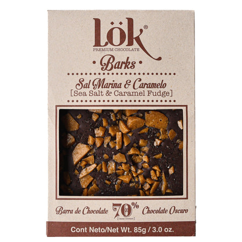 Box of Lök Premium Chocolate Sal Marina & Caramelo with chocolate pieces on a white background