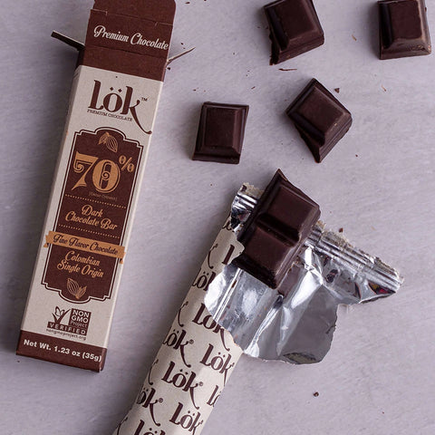 Chocolate bar with packaging on a gray surface